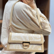 Sac à main élégant en tissu brodé et cuir