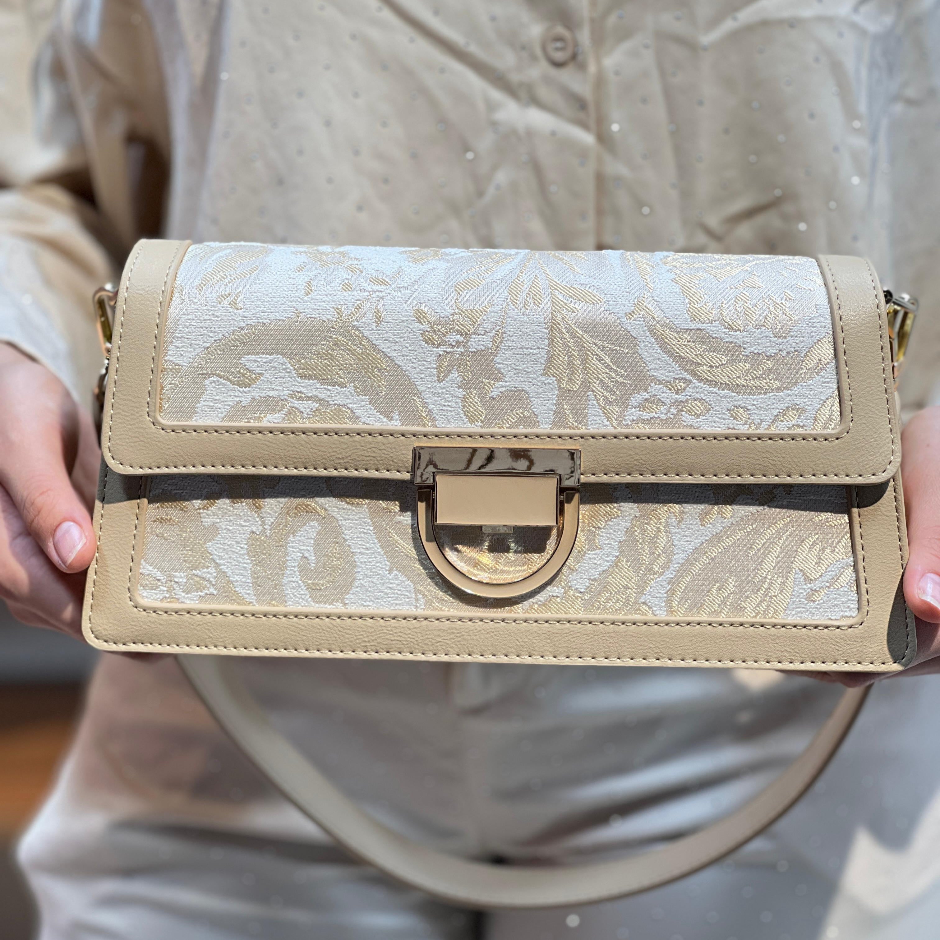 Sac à main élégant en tissu brodé et cuir