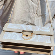 Sac à main élégant en tissu brodé et cuir