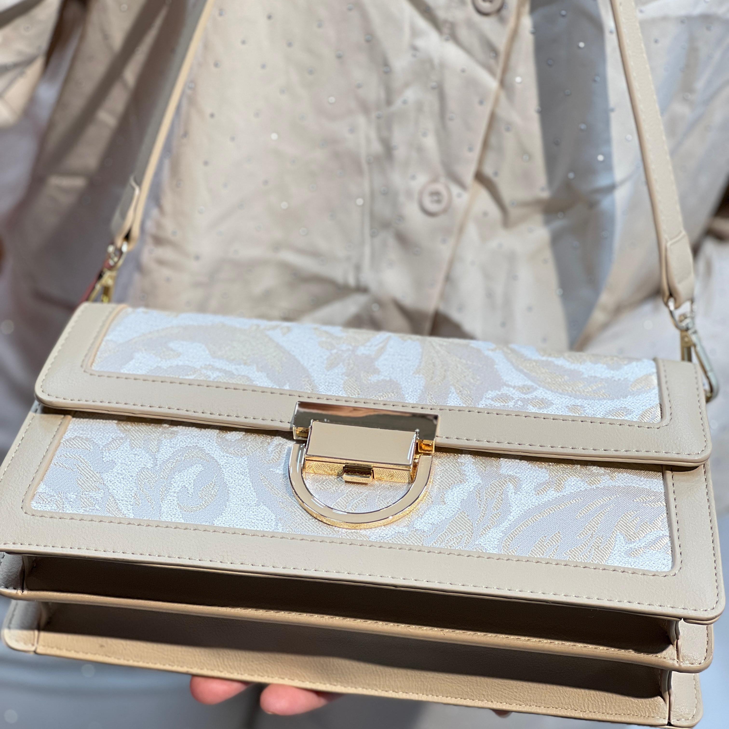 Sac à main élégant en tissu brodé et cuir