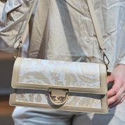 Sac à main élégant en tissu brodé et cuir