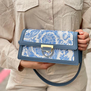 Sac à main élégant en tissu brodé et cuir