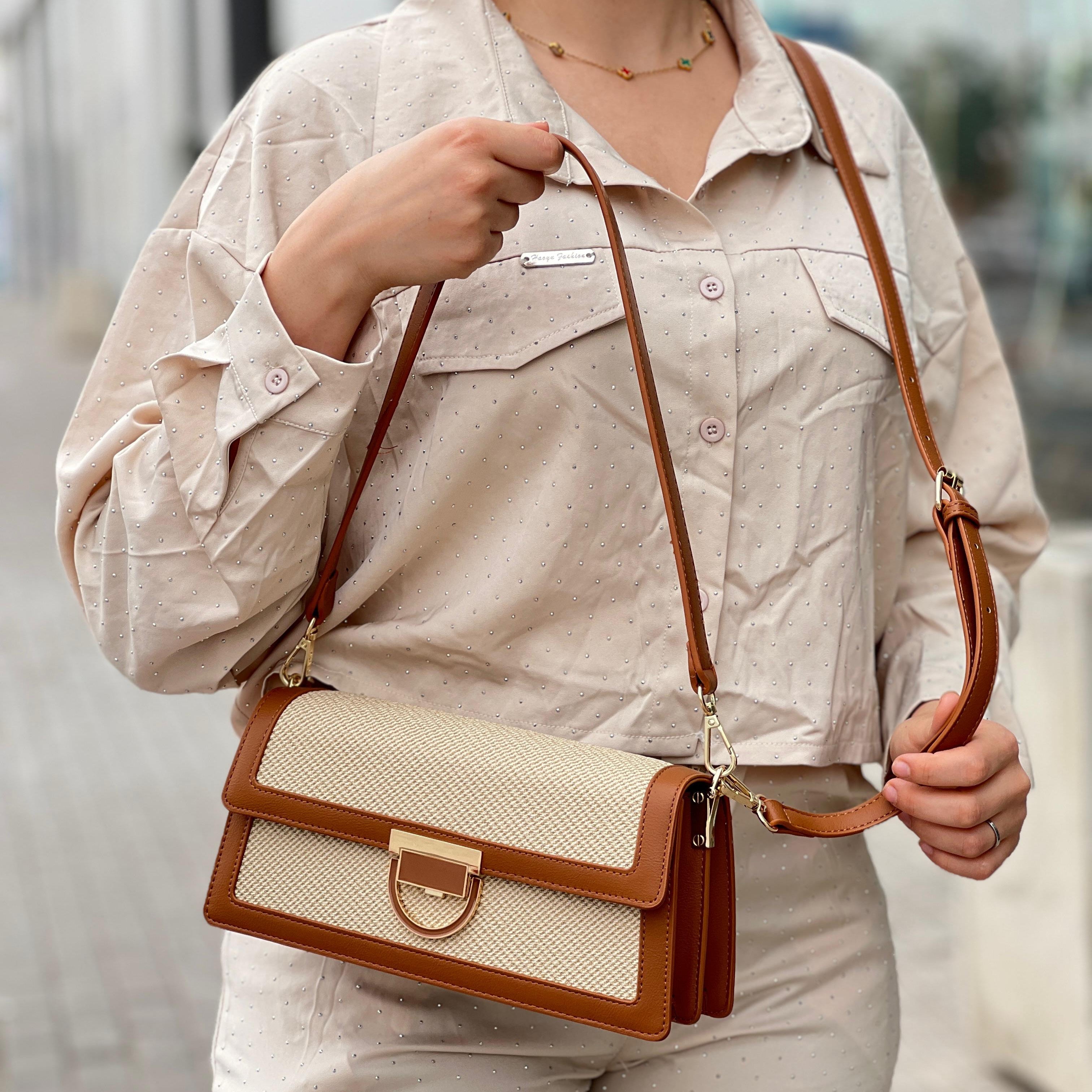 Sac à main élégant en tissu brodé et cuir