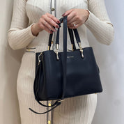 Passer au début de la galerie d'images   Sac à main minimaliste effet cuir